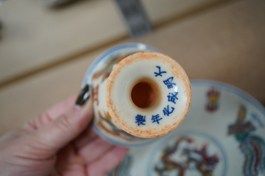 A pair of Chinese pedestal cups and three saucers. Condition - one cup severely damaged